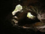 Rock cave with two openings to the outside.