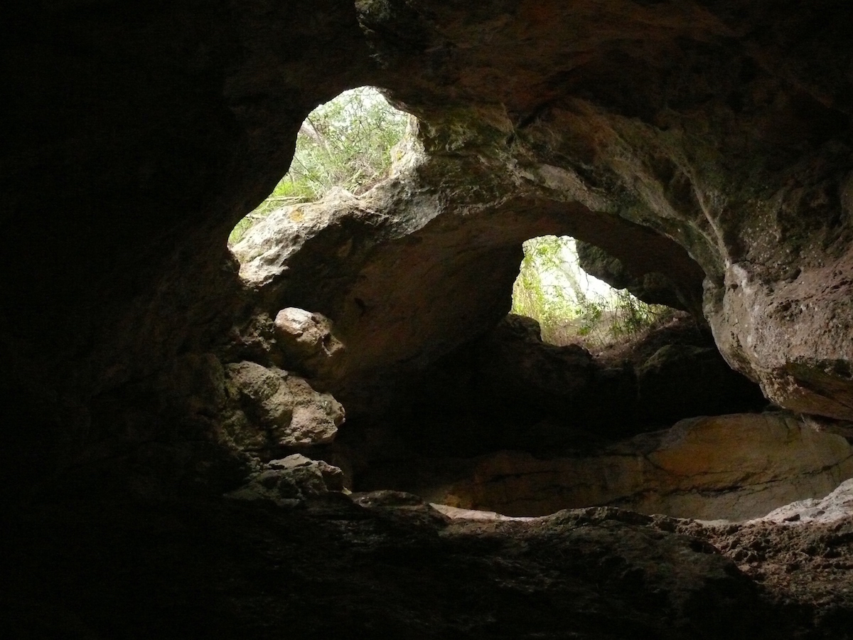 Rock cave with two openings to the outside.