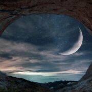 looking out from cave at sea and moon