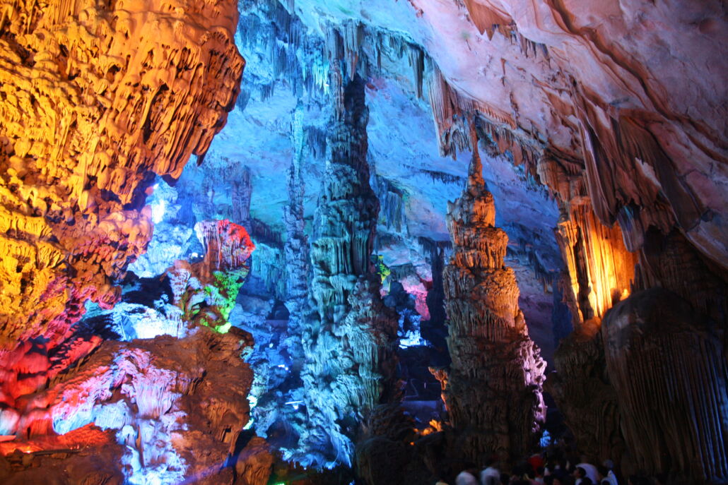 colorful inside of cave seen through an opening