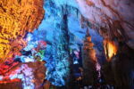 colorful inside of cave seen through an opening
