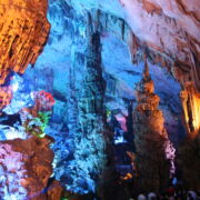 colorful inside of cave seen through an opening