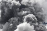 gray smoke from volcano obscuring sky