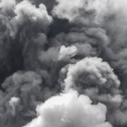 gray smoke from volcano obscuring sky