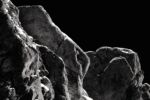 black and white photo of rocks in a dark setting; ominous