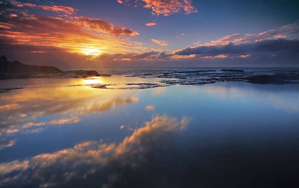 lightTimDonnelly albumarium sunrise on water with clouds and reflections