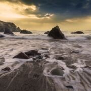Waves crashing on shore amid rocks