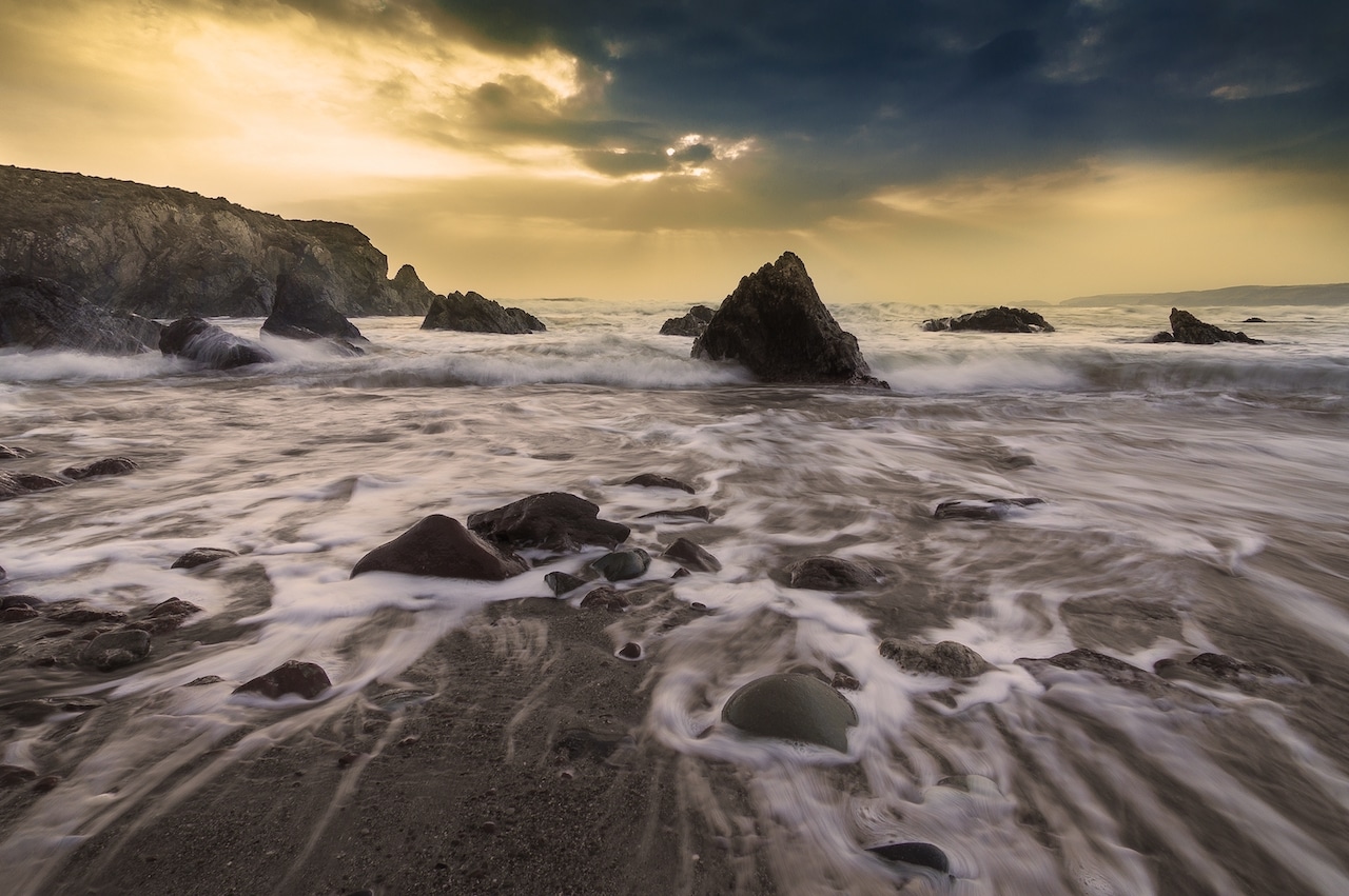 Waves crashing on shore amid rocks