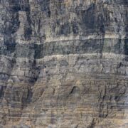 Gray, sheer rock wall with no openings.