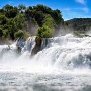 Swiftly rushing water over jagged rocks.