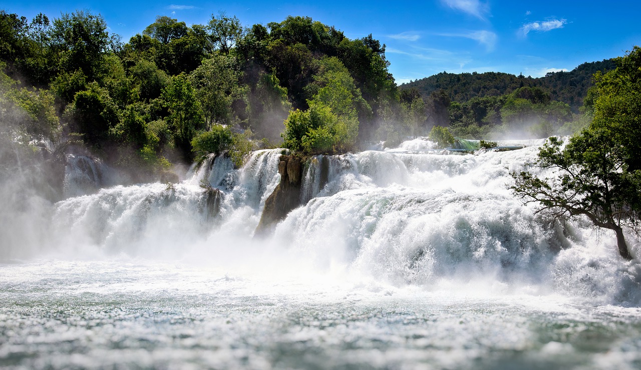 Swiftly rushing water over jagged rocks.