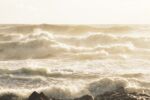 Very rough gray sea and waves.