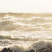 Very rough gray sea and waves.