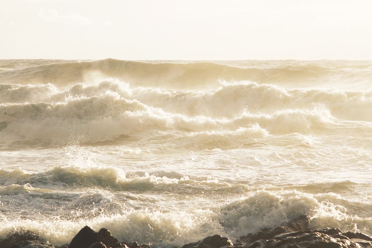 Very rough gray sea and waves.