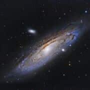 A colorful nebula in space with an opening.