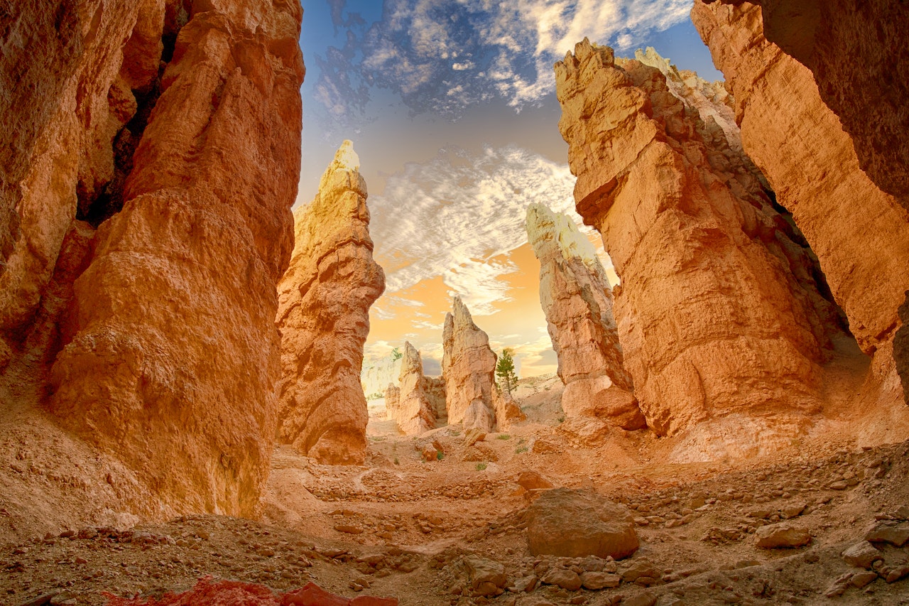 Red rock formation with tall, jagged rock towers.
