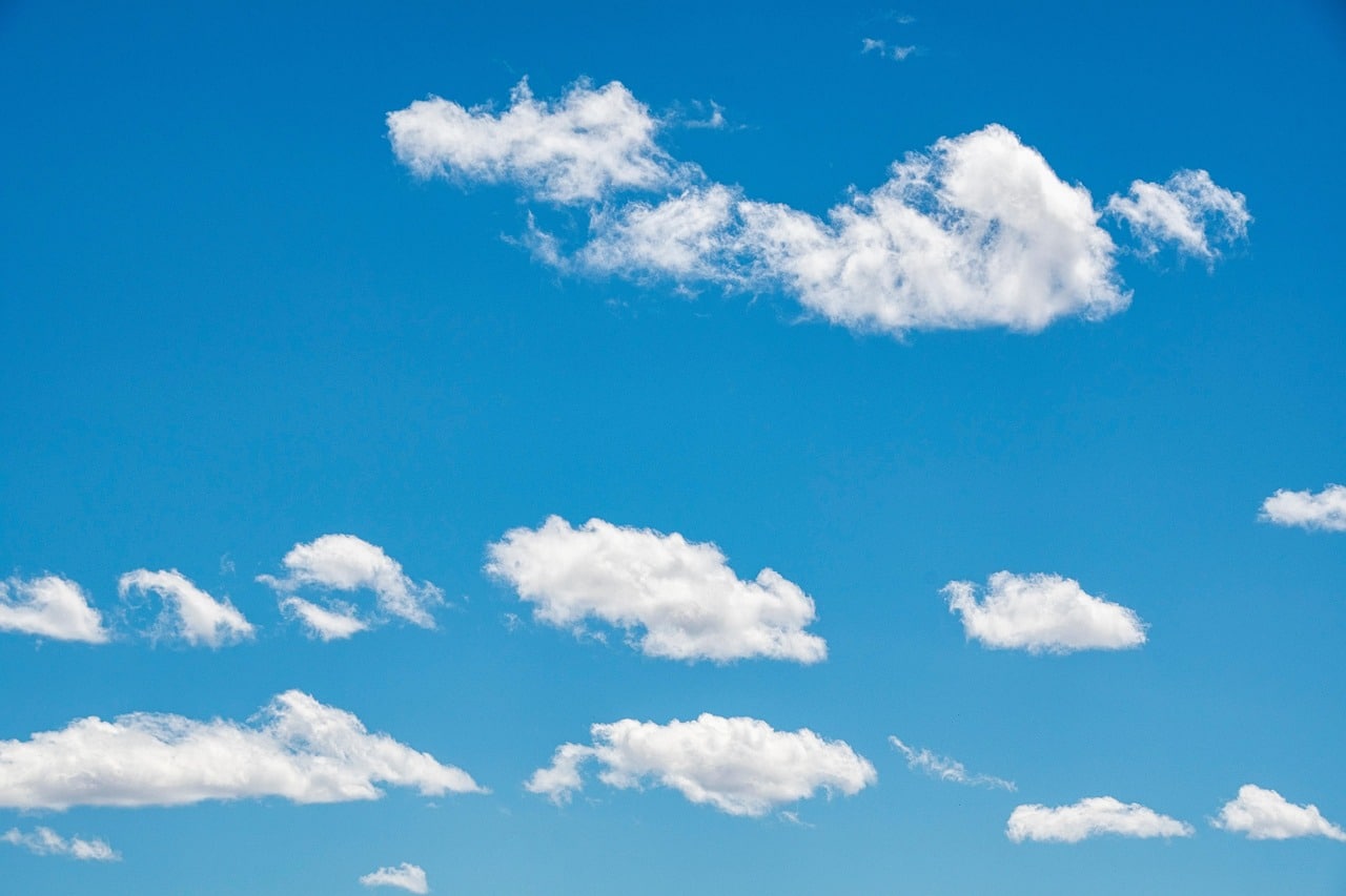 Beautiful white clouds scattered on a blue sky.