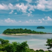 Small, tree-covered islands in a blue sea.